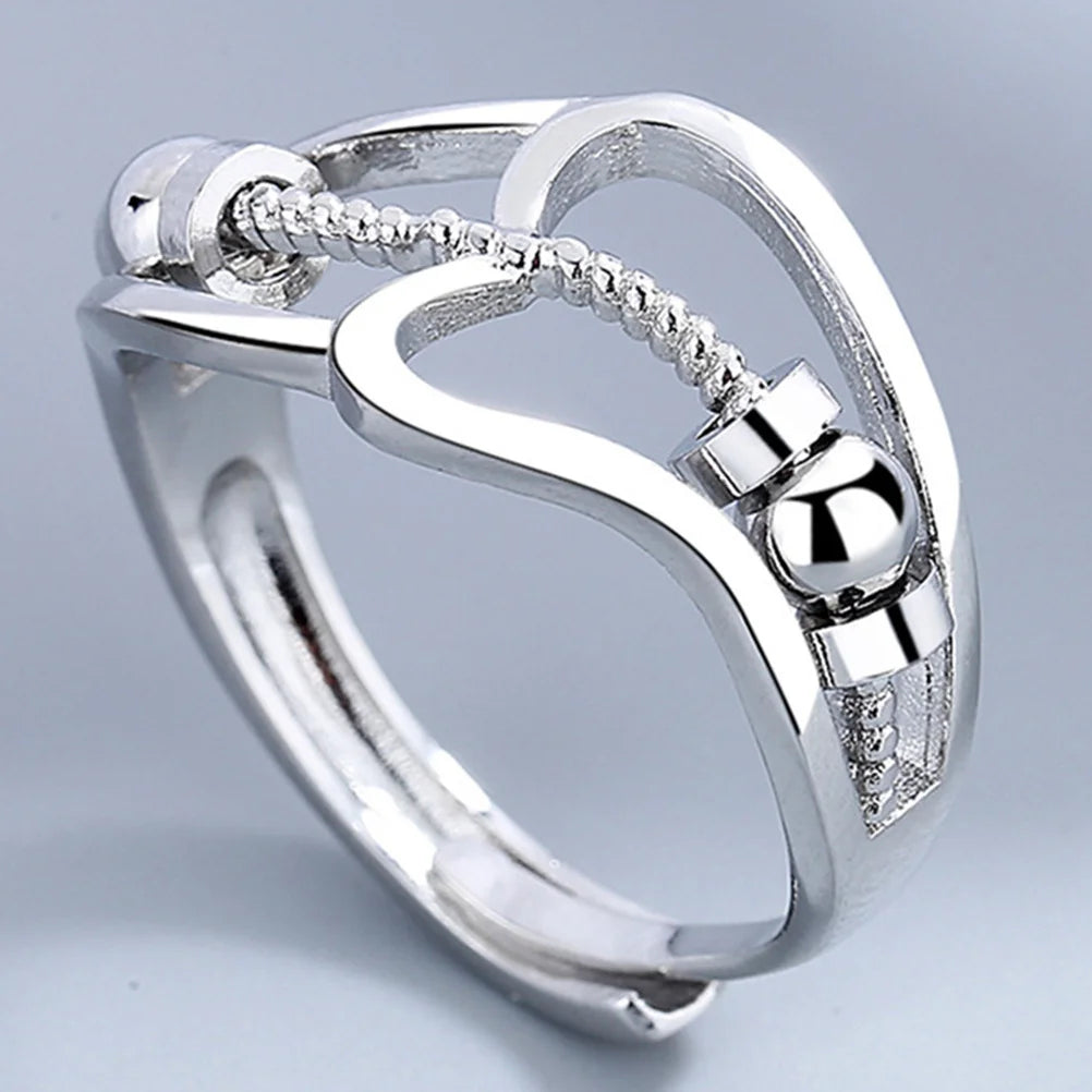 Bague anti-stress pour femme avec perles rotatives.