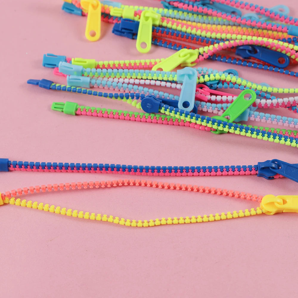 Bracelets anti-stress à fermeture éclair (15 pièces).