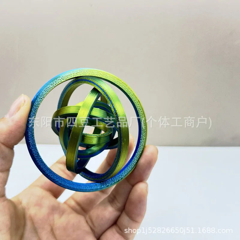 Jouet anti-stress rotatif imprimé 3D avec 6 anneaux.