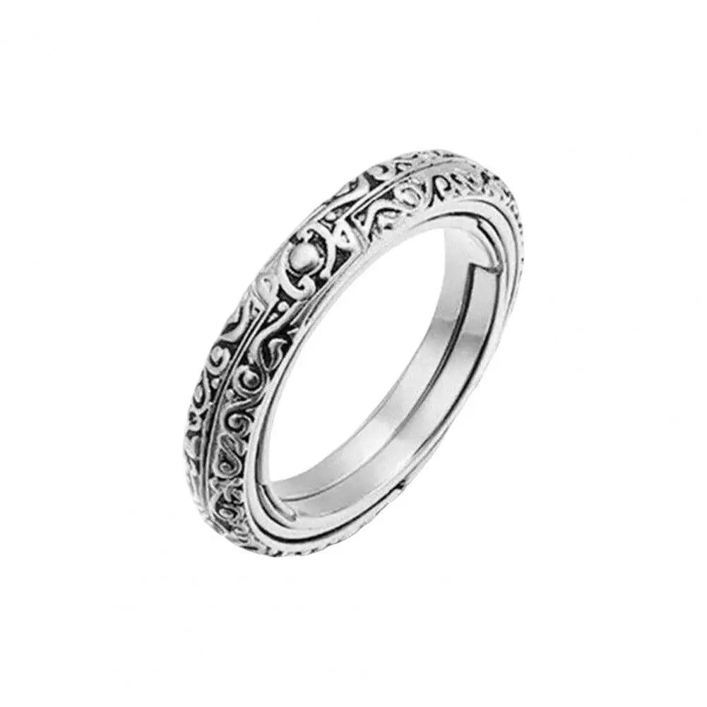 Bijou anti-stress, bague en acier titane qui se transforme en pendentif.