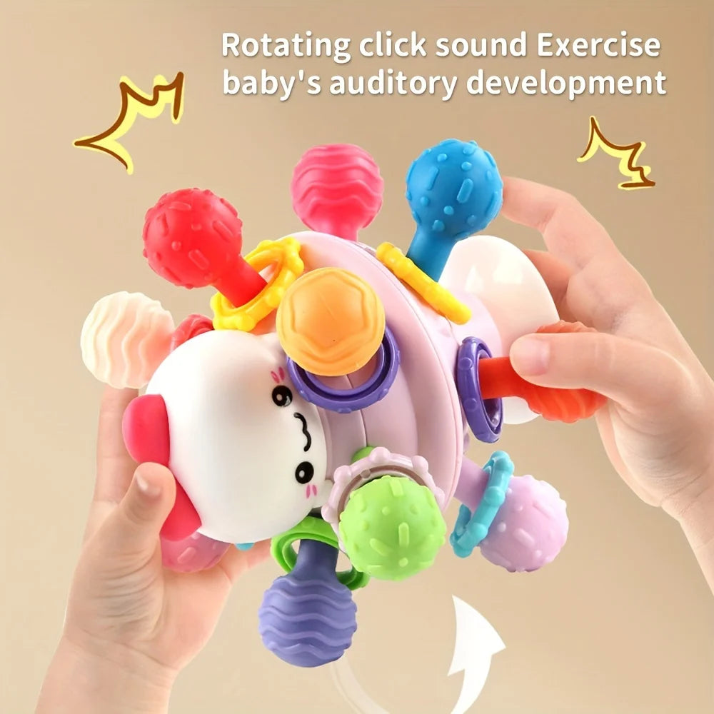 Balle de préhension  avec anneaux de dentition.