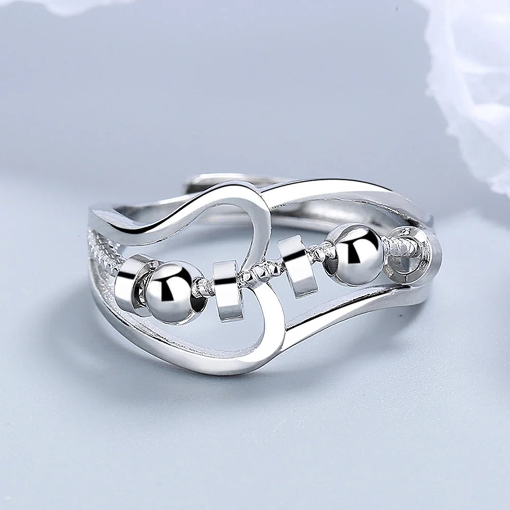 Bague anti-stress pour femme avec perles rotatives.